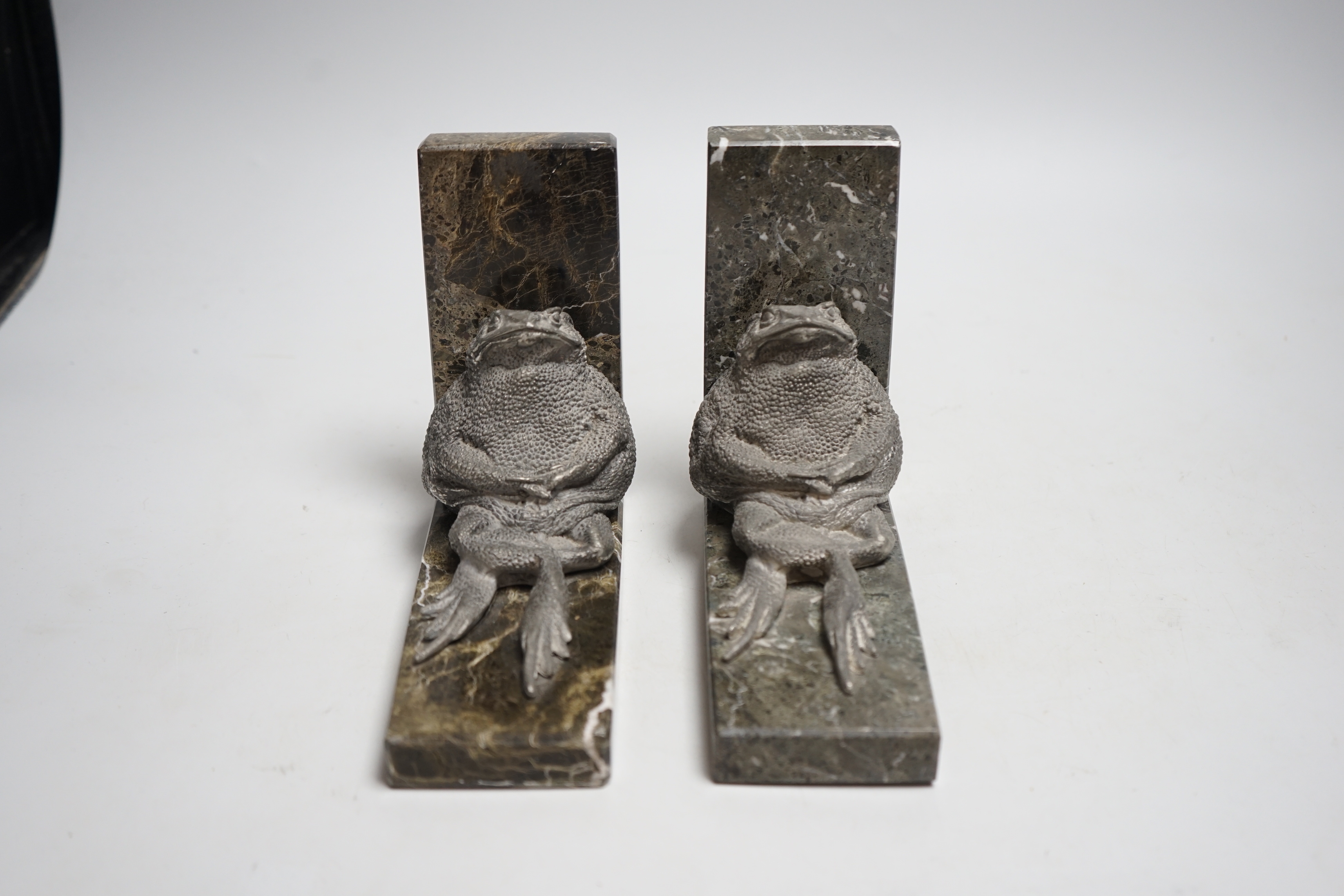 A pair of spelter and marble ‘toad’ bookends, 15cm high, 17.5cm long